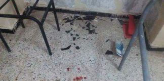Photos showing blood on ground, broken chairs and glass inside a TV room
